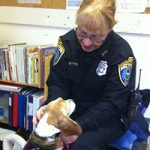 Nancy Bersani, Animal Control Officer, petting beagle — testimonial for Alana Stevenson's shelter training and science-based methods